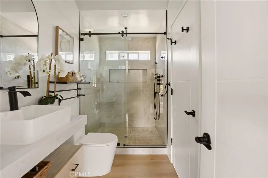 2nd level bathroom with walk in shower and modern fixtures, photo from Unit A (nearly identical unit)