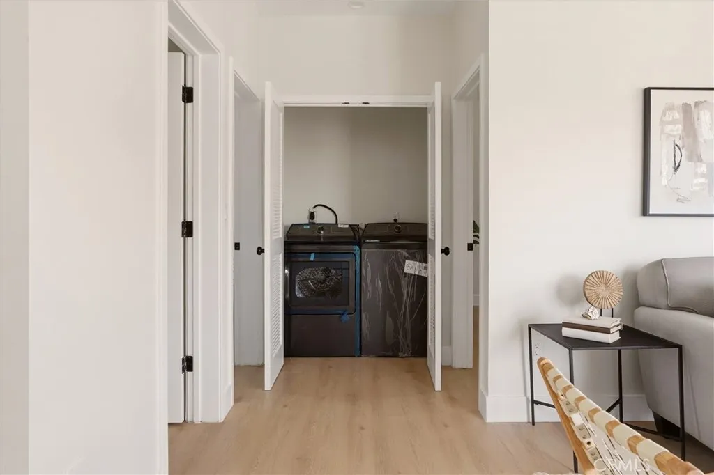 Laundry area in closet on 3rd floor, photo from Unit A (nearly identical unit)