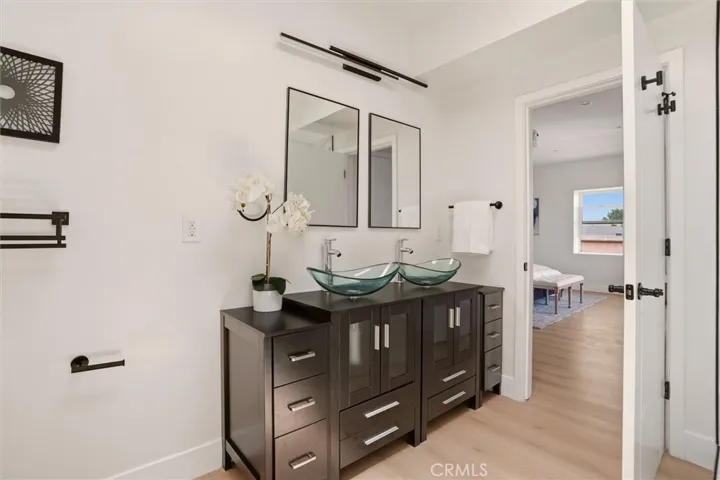 Double sinks in primary bathroom, photo from unit A (nearly identical units)