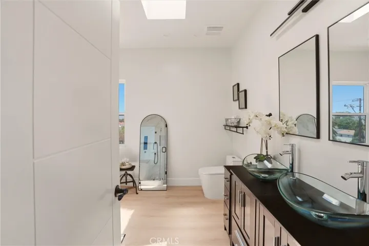 Double sinks in primary bathroom, photo from unit A (nearly identical units)