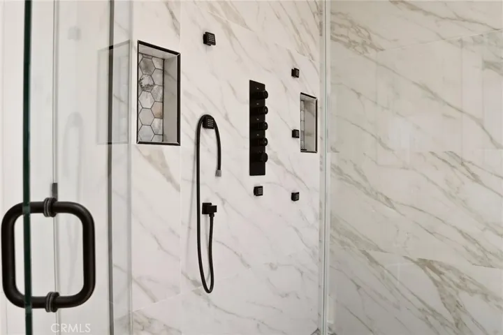 Modern shower in primary bathroom, photo from unit A (nearly identical units)