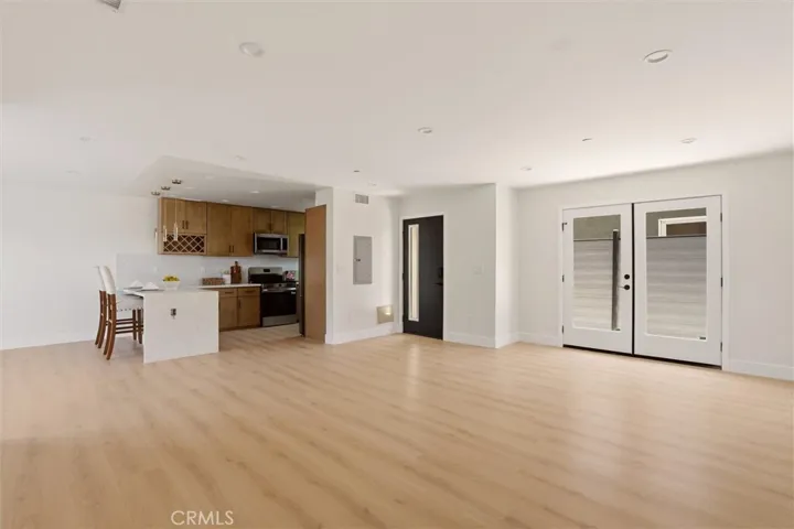 Unstaged living space from unit B