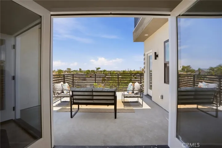 2nd level balcony off of 2nd floor living space, photo from unit A (nearly identical units)