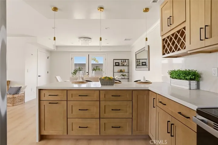Waterfall counter separates kitchen and dining space photo from Unit A (nearly