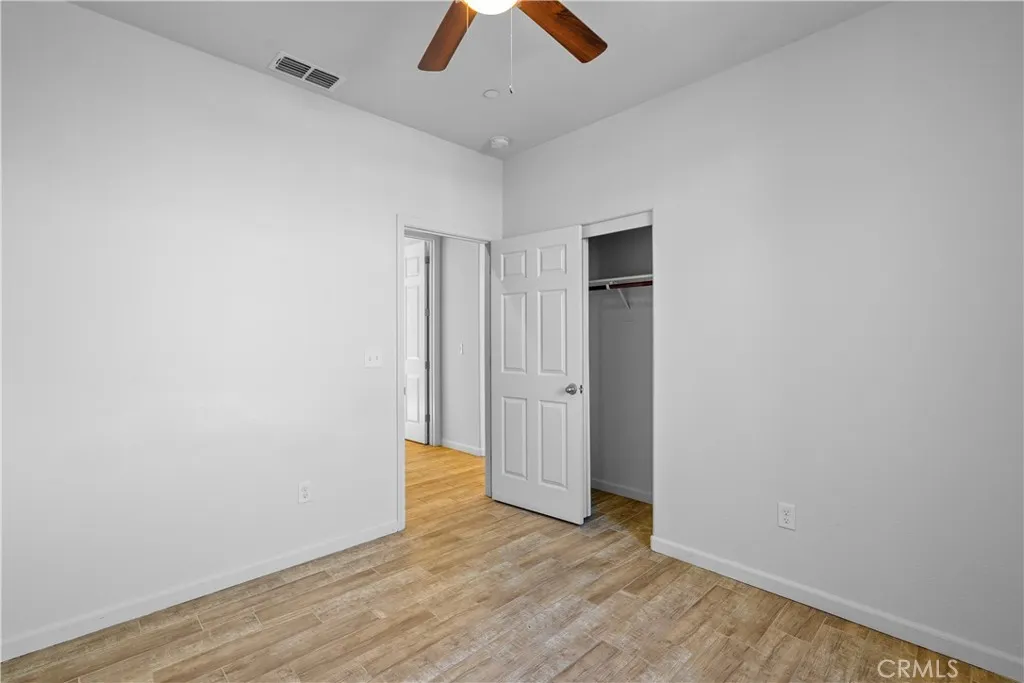 Hall Bedroom 1 with ceiling fan