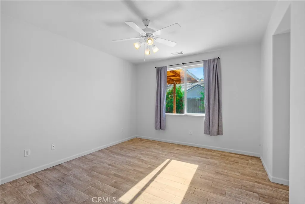 Primary bedroom with ceiling fan