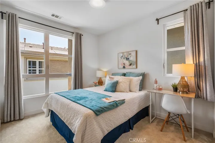 Bedroom 2 with lots of natural light and high ceilings