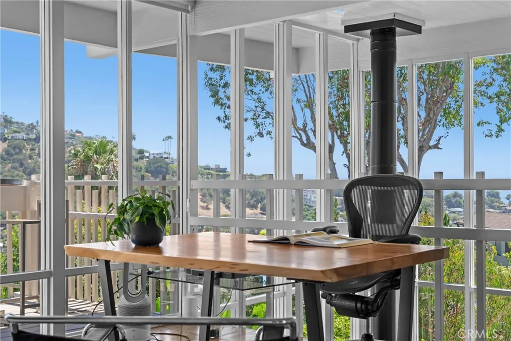 loft with access to upper level deck currently furnished as an office