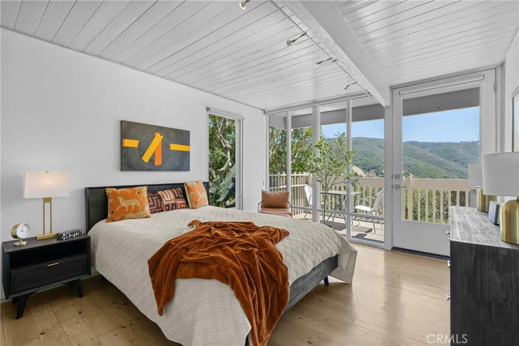 bedroom with access to upper level deck