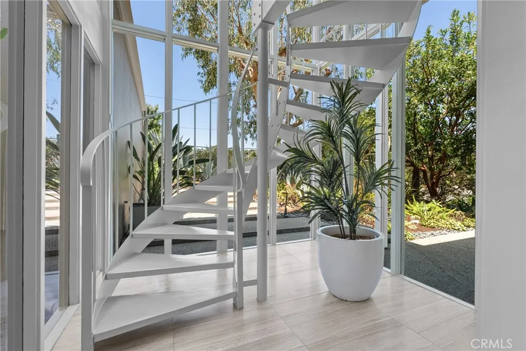 stairs to upstairs with two rooms and deck
