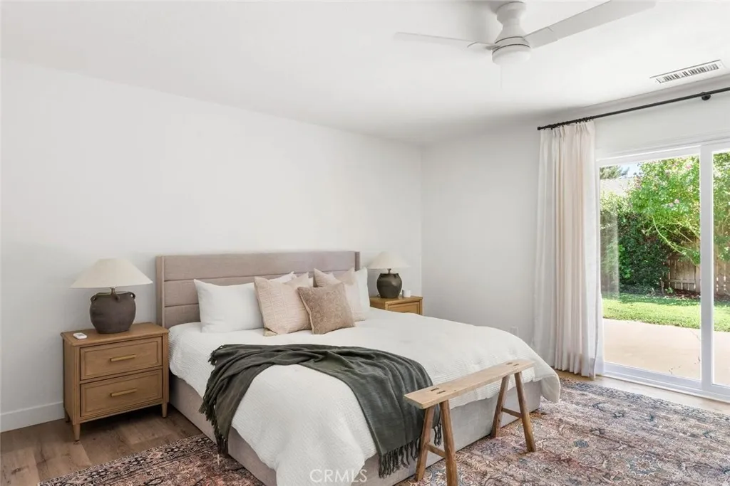 Large primary bedroom with backyard access.