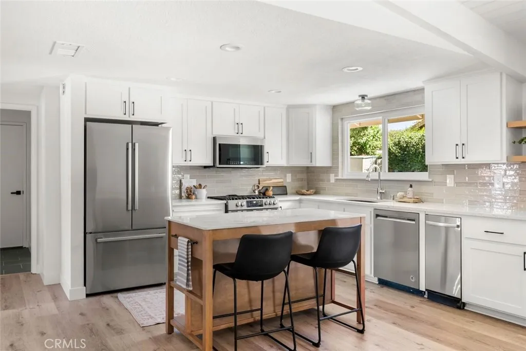 Beautifully updated kitchen with quartz counter tops, new cabinet fronts and freshly painted.