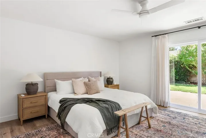 Large primary bedroom with backyard access.