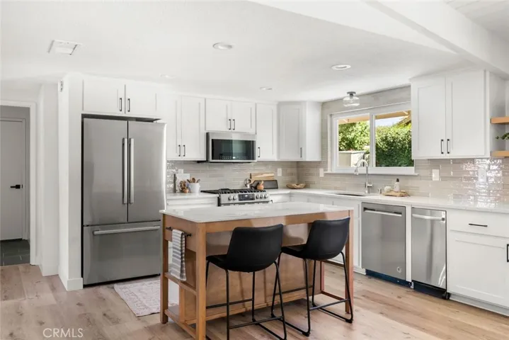 Beautifully updated kitchen with quartz counter tops, new cabinet fronts and freshly painted.
