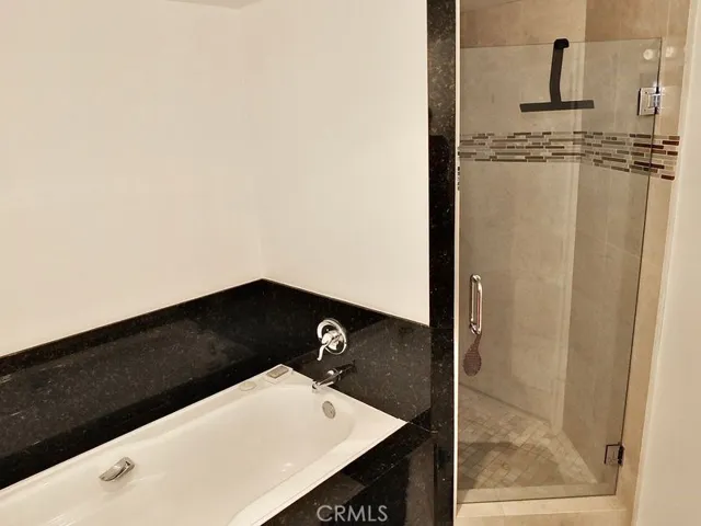 bathroom full tub and walkin shower