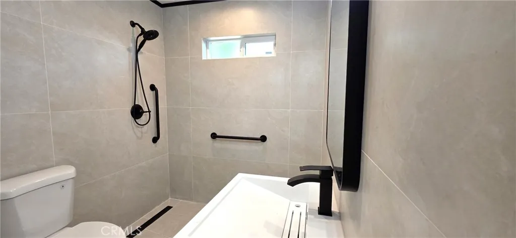 Bathroom 1 with wheelchair accessible shower