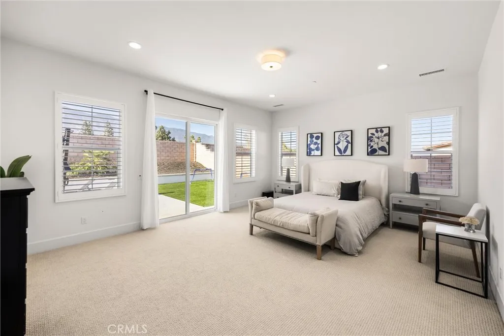 primary suite overlooking backyard