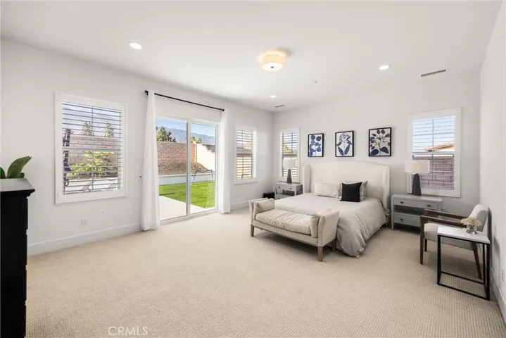 primary suite overlooking backyard