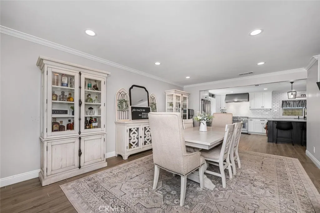 Neutral color palette enhanced with crown molding and recessed lighting.