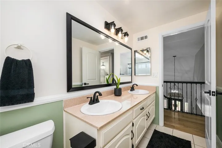New fixtures, refinished tub & tile, Corian countertop includes two new sinks.