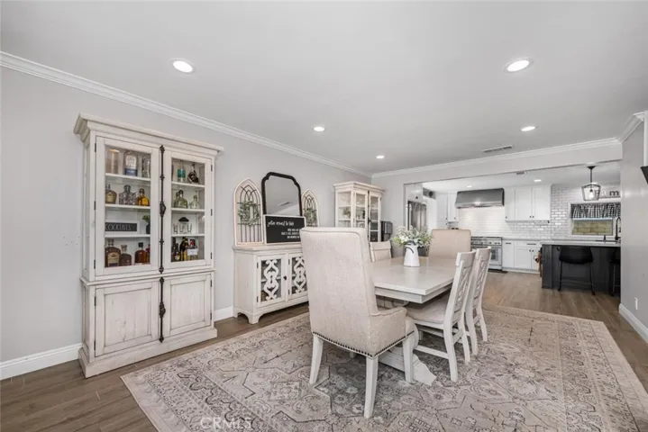 Neutral color palette enhanced with crown molding and recessed lighting.