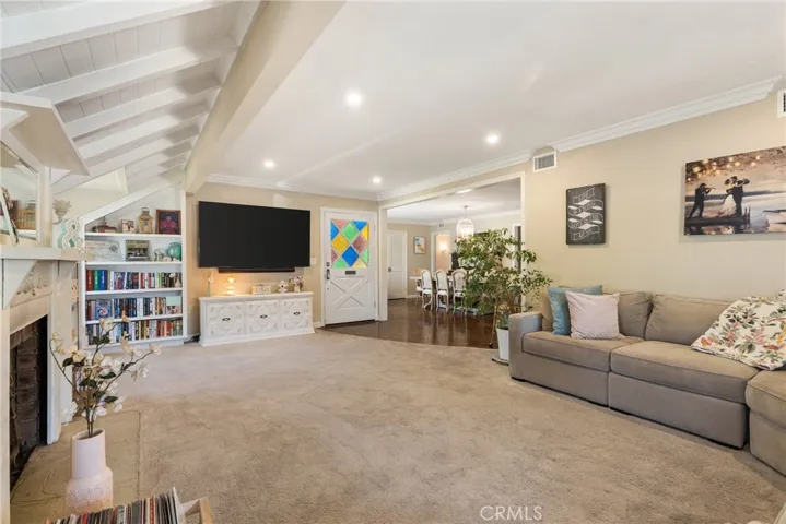 View from the living room toward the front door and dining.