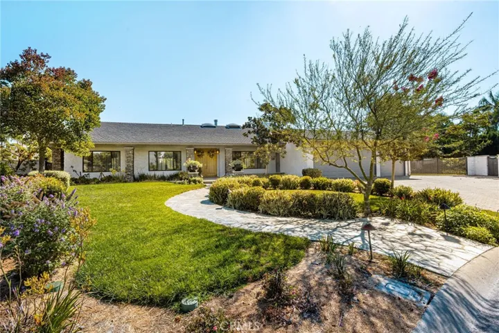 Front of Home with paver driveway, 3 car garage, Rv parking