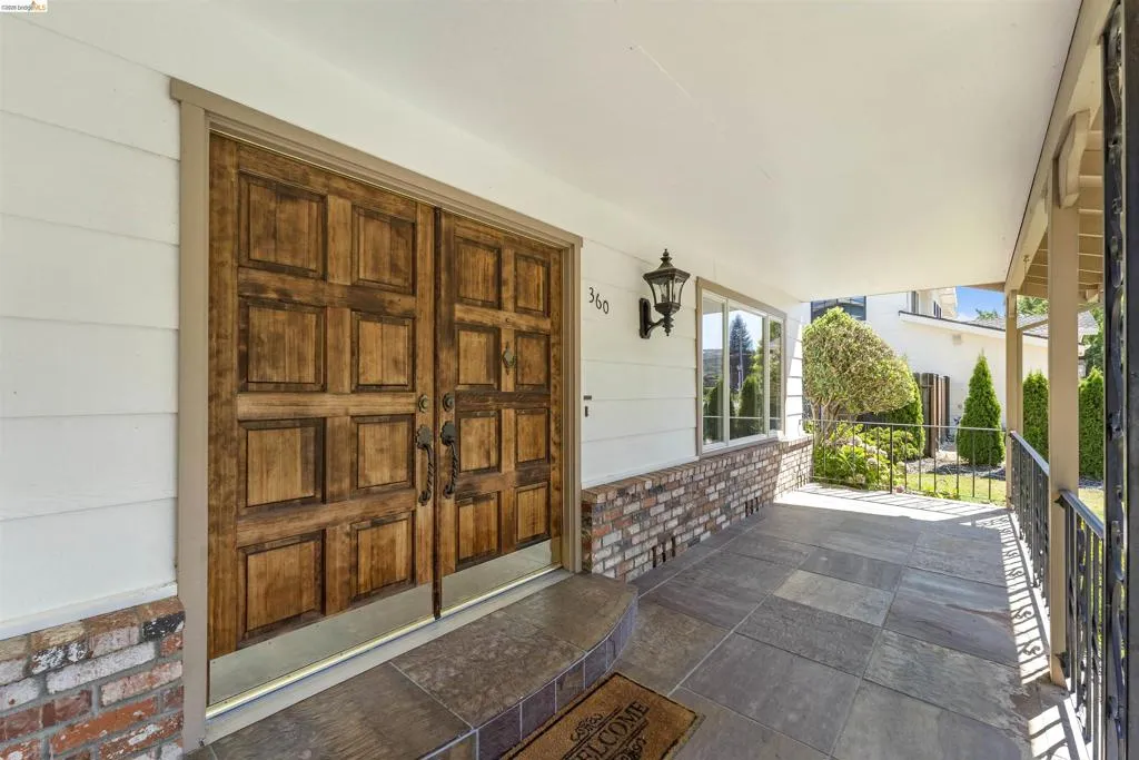 Front entry featuring double wood doors with panel detailing
