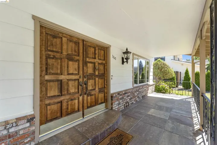 Front entry featuring double wood doors with panel detailing