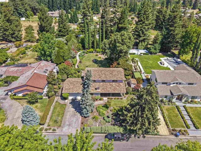 Expansive property featuring mature trees and lush landscaping