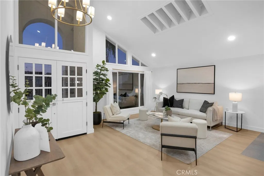 Living room with vaulted ceilings and skylights