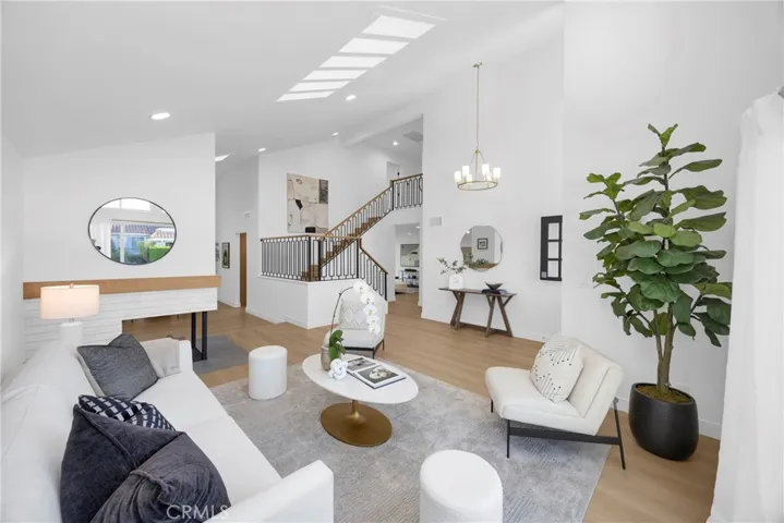 Living room with vaulted ceilings and skylights