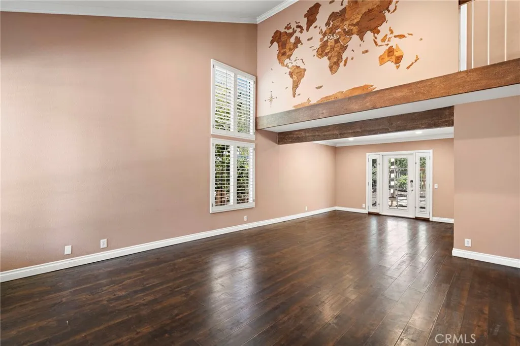 Vaulted ceilings and a spacious living room provide a comforting welcome as you begin to explore the upgraded property.