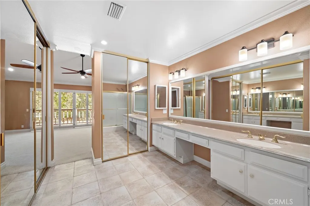 Primary bathroom suite with ample closet space.