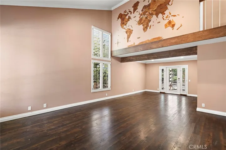 Vaulted ceilings and a spacious living room provide a comforting welcome as you begin to explore the upgraded property.