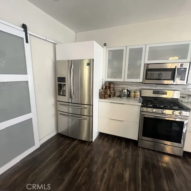 Barn Door to Separate Laundry Room, Kitchen Partial