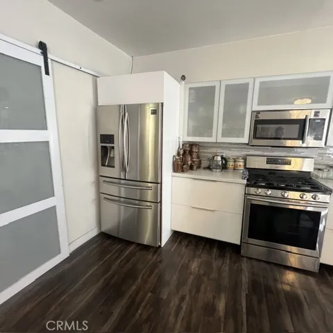 Barn Door to Separate Laundry Room, Kitchen Partial