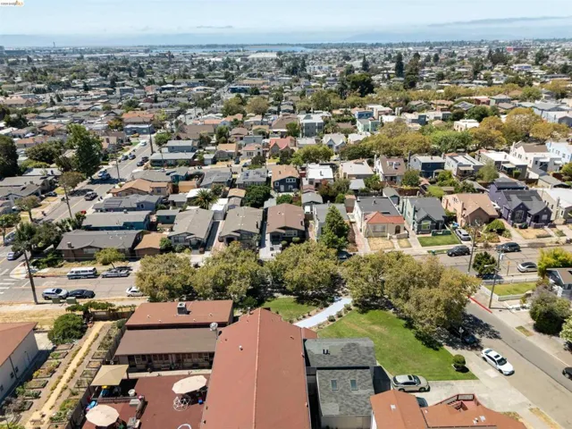 Aerial perspective of a residential neighborhood featuring diverse architectural styles and mature trees