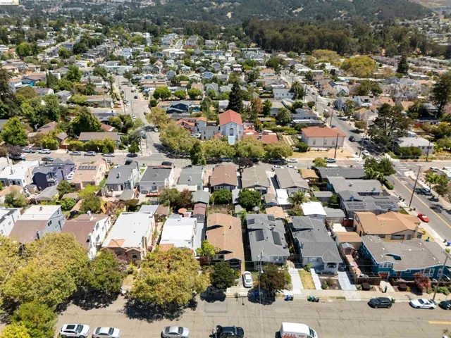 Residential neighborhood with varied architectural styles and established tree canopy