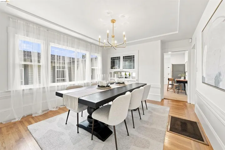 Dining area featuring hardwood flooring and white baseboards