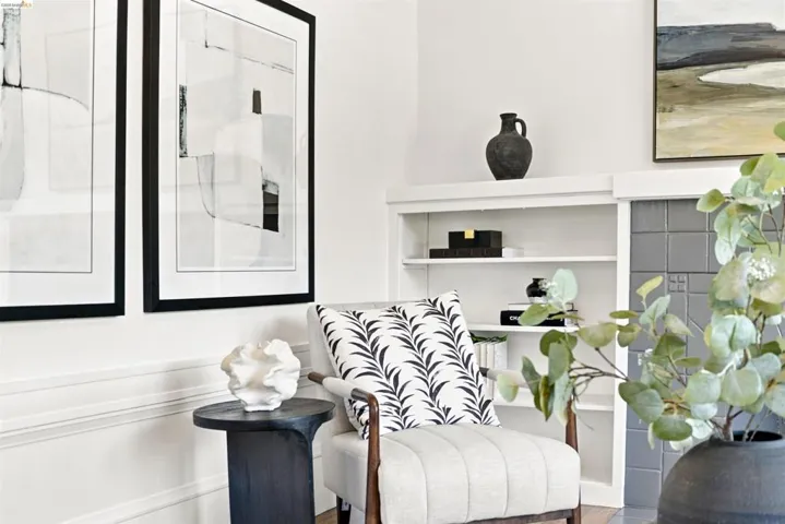 Built-in shelving unit featuring multiple display levels and a gray tiled surround