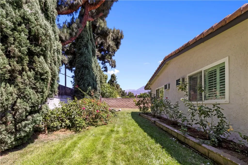 Green space wraps around the side of the home