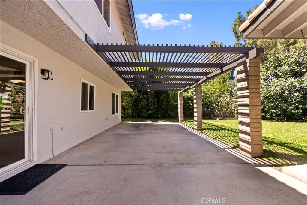 Stylish pergola-covered patio adds architectural charm