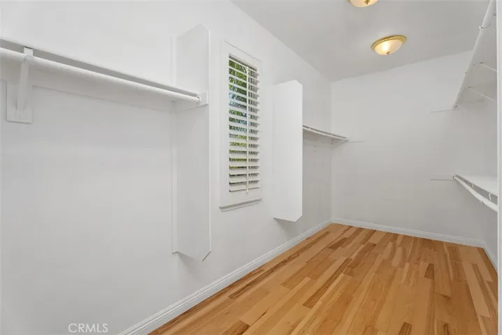 Primary closet in bathroom