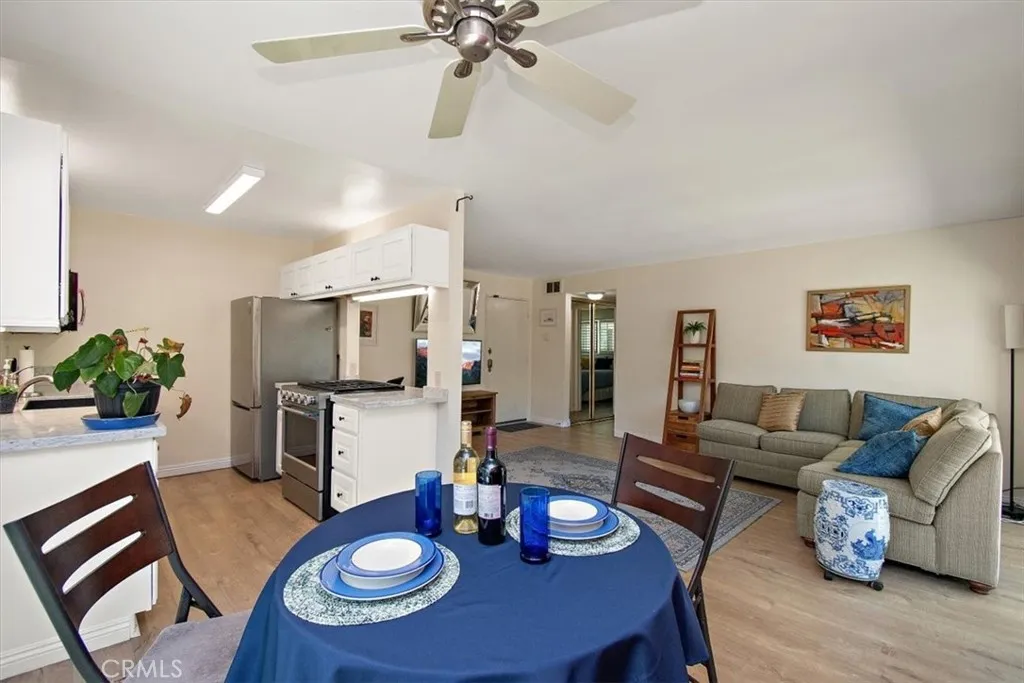 Open floor plan kitchen, dining, balcony, living room