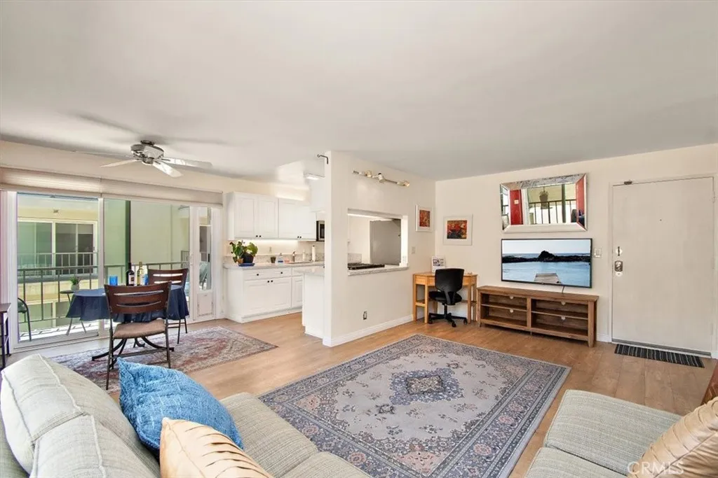 Open floor plan kitchen, dining, balcony, living room