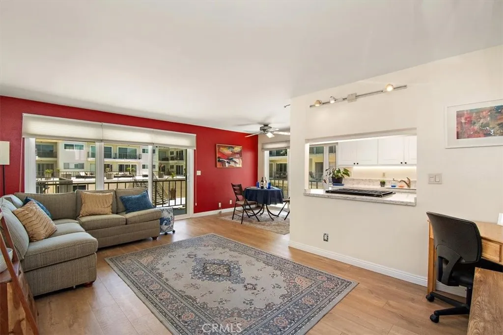 Open floor plan kitchen, dining, balcony, living room