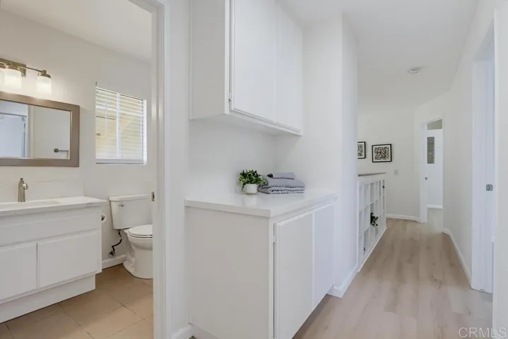 Upstairs hallway features additional linen closet