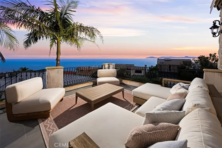 Expansive viewing deck directly off the primary suite, offering endless ocean vistas and front-row views of breathtaking Catalina Island sunsets.