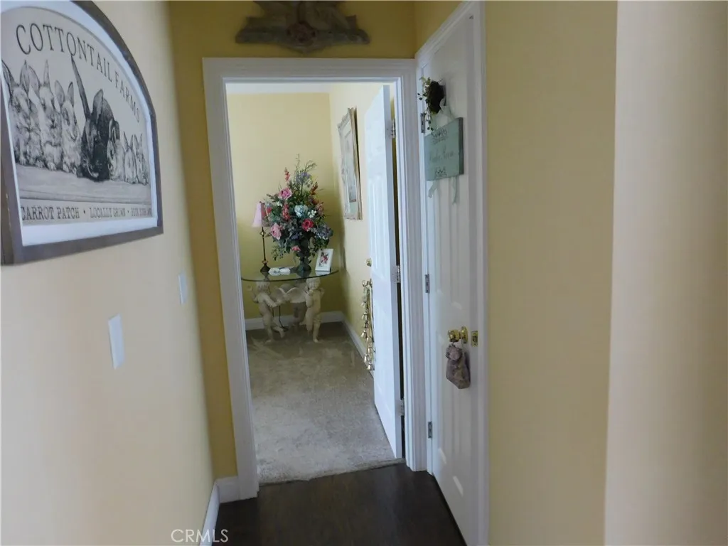 Hallway with 1/2 bath on right side